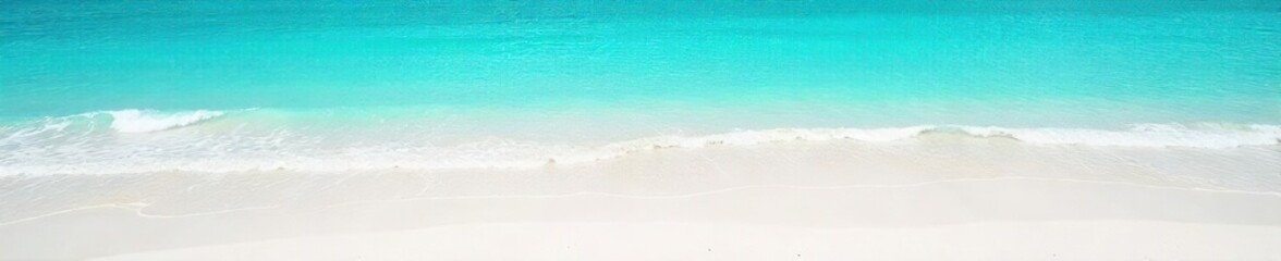 Tranquil Turquoise Ocean Waves Gently Lap Pristine White Sand Beach, Idyllic Coastal Scene Perfect for Travel, Vacation, and Summer Themes