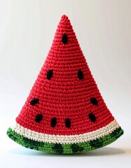 Crocheted Watermelon Slice With Black Seeds on White Background