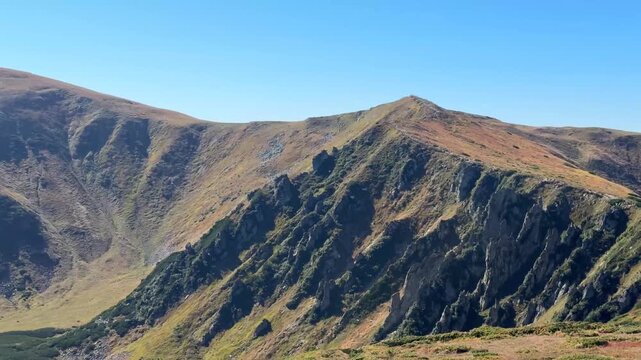 mountain range panning over rugged ridges and slop