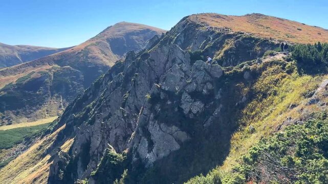 picturesque mountain range aerial view with hikers