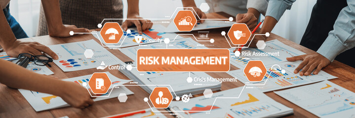 Engaging scene showcasing a diverse team of professionals discussing risk management strategies through data visualization. Focus on collaboration and effective planning techniques. Amity
