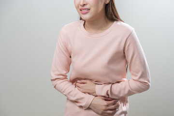 Flatulence asian young woman intolerance hand in stomach ache, suffer from food poisoning,...