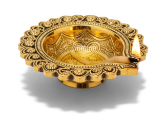 A golden, ornate diya with a lit candle inside, placed on a png transparent.