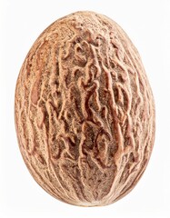 Fototapeta premium Detailed Nutmeg Seed Close Up with Intricate Texture Isolated on White Background