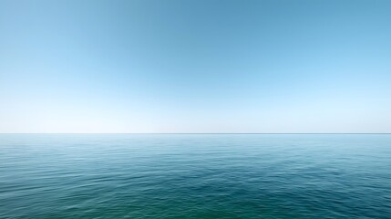 Obraz premium Minimal calm ocean horizon under clear blue sky with smooth water surface, symbolizing peace, balance, and natural tranquility perfect for meditation, relaxation, and serene background design