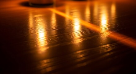 Warm light reflecting on a wooden surface creating a cozy and inviting atmosphere in the room