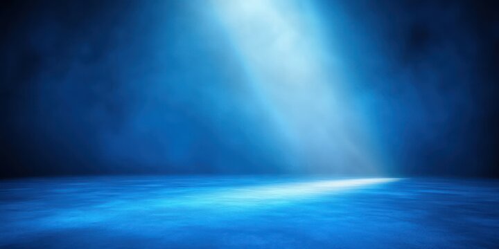 mystical blue light beam shining through misty darkness over smooth blue surface creating a serene and mysterious atmosphere