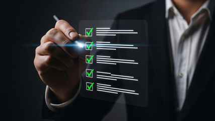 Businessman checking off tasks on a digital checklist