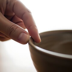Touching Edge of Bowl Close Up Hand and Simple Design