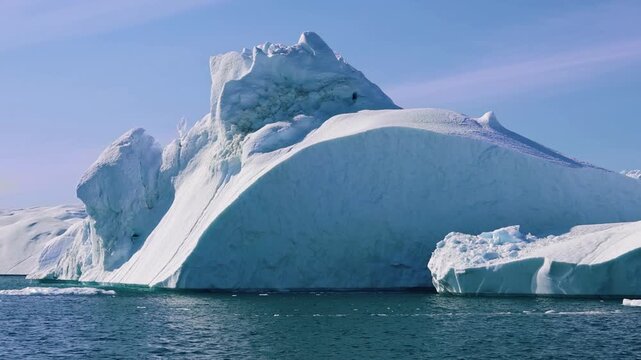 Boat excursion near icebergs of Kangia Fjord and Sermeq Kujalleq glacier in Ilulissat, Greenland
