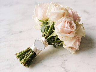 Rose Bouquet: A delicate rose bouquet tied with elegant ribbon, embodying the classic beauty and romance, set against a marble texture background.