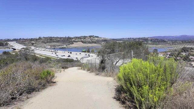 A peaceful walking scene at the upper portion of Annie&rsquo;s Canyon Trail offers a panoramic view of Interstate 5 and the San Elijo Lagoon.