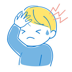ひどい頭痛のため頭を手で押さえている男の子