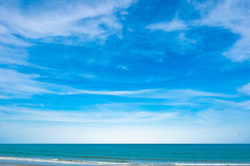 Nature of the ocean and blue sky Summer with sunshine, sandy beaches, clear blue waters sparkling against the blue sky. on an island with good ecology and environment Background for summer vacation