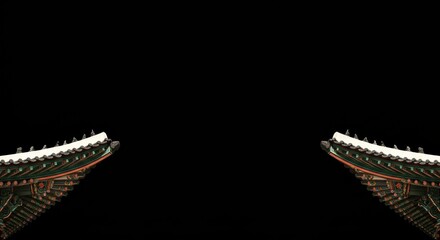 Ornate korean palace roof detail against black background