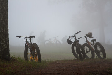 A bicycle parked in the mist for mountain touring.