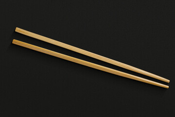 Pair of reusable chopsticks on dark background