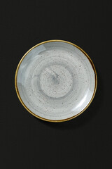 Ceramic plate on dark background