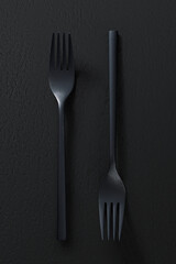 Black forks on dark background