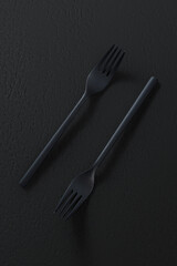 Black forks on dark background