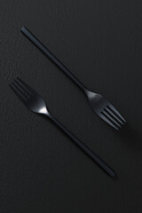 Black forks on dark background