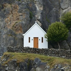 Minimalist white house nestled against dramatic rocky cliffs and surrounded by lush green nature, blending modern simplicity with rustic mountain landscape for peaceful countryside living
