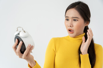 Shocked Asia young woman looking at clock alarm, lady is late appointment or work or class study,...