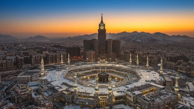 Aerial view of the grand mosque and abraj albait clock tower at sunset