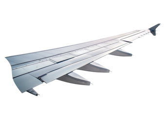 Airplane wing with flaps extended against a black sky