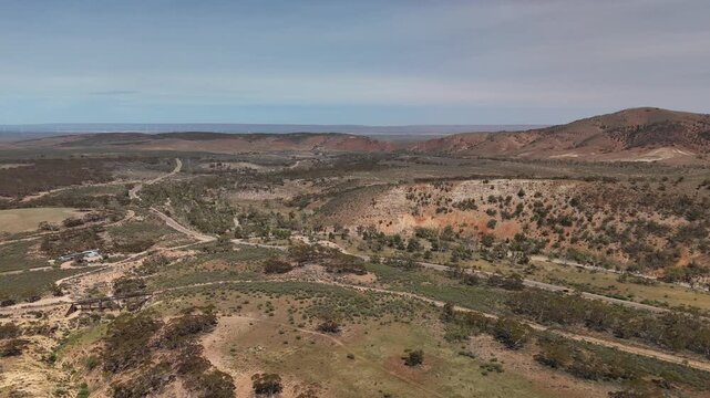 Saltia, South Australia &ndash; 4K Aerial Drone Footage of Woolshed Flat Train Stop, Pichi Richi Railway, Outback Hills and Terrain, Winding Roads, Countryside, Rural Landscape near Quorn, Flinders Ranges