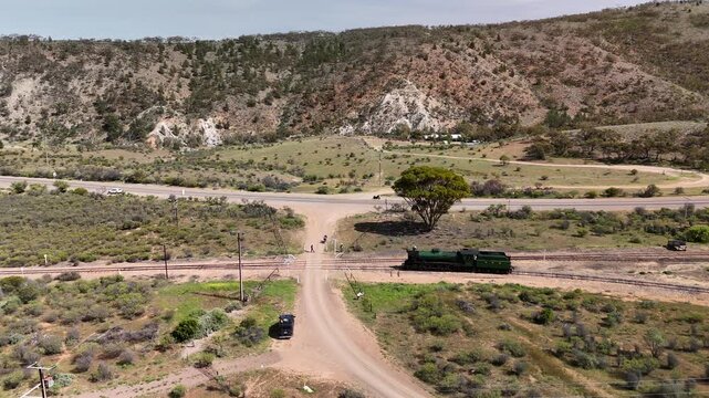 Saltia, South Australia &ndash; 4K Aerial Drone Footage of Woolshed Flat Train Stop, Pichi Richi Railway, Outback Hills and Terrain, Winding Roads, Countryside, Rural Landscape near Quorn, Flinders Ranges