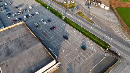 Aerial view of Castelvetro Piacentino featuring a spacious parking lot next to a sizable commercial...