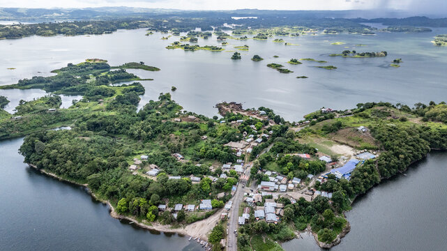 panoramic aerial landscape view of area around Akua Yala in Babita de Perro, Panama, with "Carretera Interamericana" highway and Bayano Lake with with small islands in the background