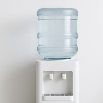 Water dispenser with large transparent water jug on top against white wall, clean minimalist style for hydration in office or home environment