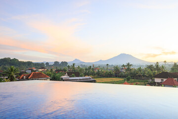 Obraz premium Beautiful view of a mountain range with a pool in the foreground