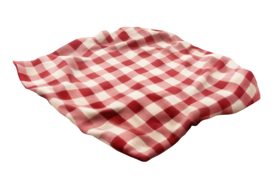 Red and white checkered picnic blanket ready for outdoor gathering on a warm sunny day in the park with friends and family enjoying a relaxing time