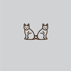 Obraz premium two cats sitting back-to-back