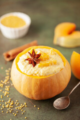 Homemage organic  pumpkin and millet porridge with cinnamon in bowl. Healthy breakfast