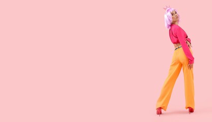 Beautiful young woman in purple wig and crown on pink background with space for text