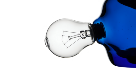 Isolated clear glass light bulb with blue liquid splash