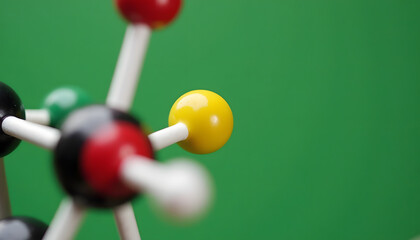 Molecular structure model against a green background