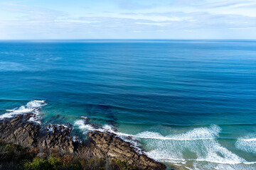 Rocky coastline along the Great Ocean Road in Australia with waves
