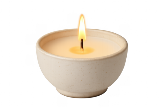 Burning candle in ceramic bowl for aromatherapy and relaxation