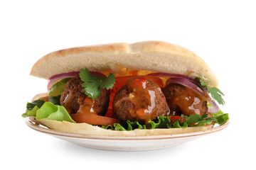 Plate of delicious pita with falafel and sauce on white background