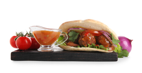 Wooden board of delicious pita with falafel and sauce on white background