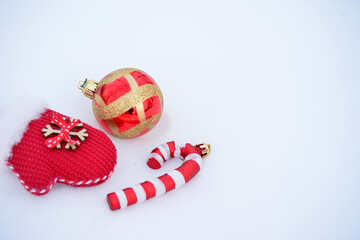 red christmas Ornaments and Mitten on White Background