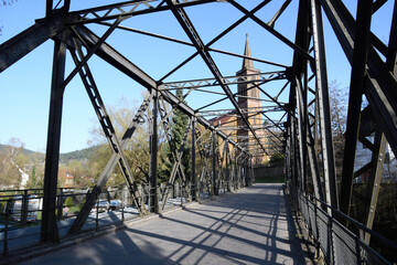 Metal bridge next to the Schiltach Church in Germany