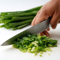 Chopping fresh green onions scallions with knife on cutting board culinary food preparation ingredient recipe