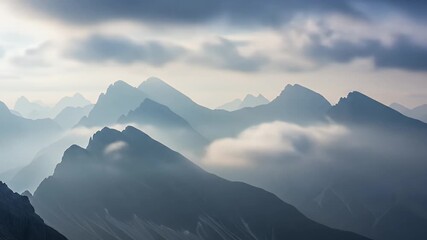 Majestic Mountain Range with Clouds and Fog at Sunrise. - Powered by Adobe