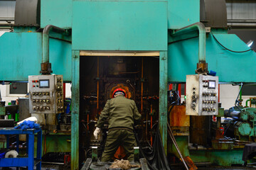 Workers on the production line of the strip steel coil factory are working